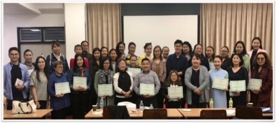 Dr. Lee (second row, slightly to the right of center) with the group of parents and professionals in Mongolia for whom he provided ABA training